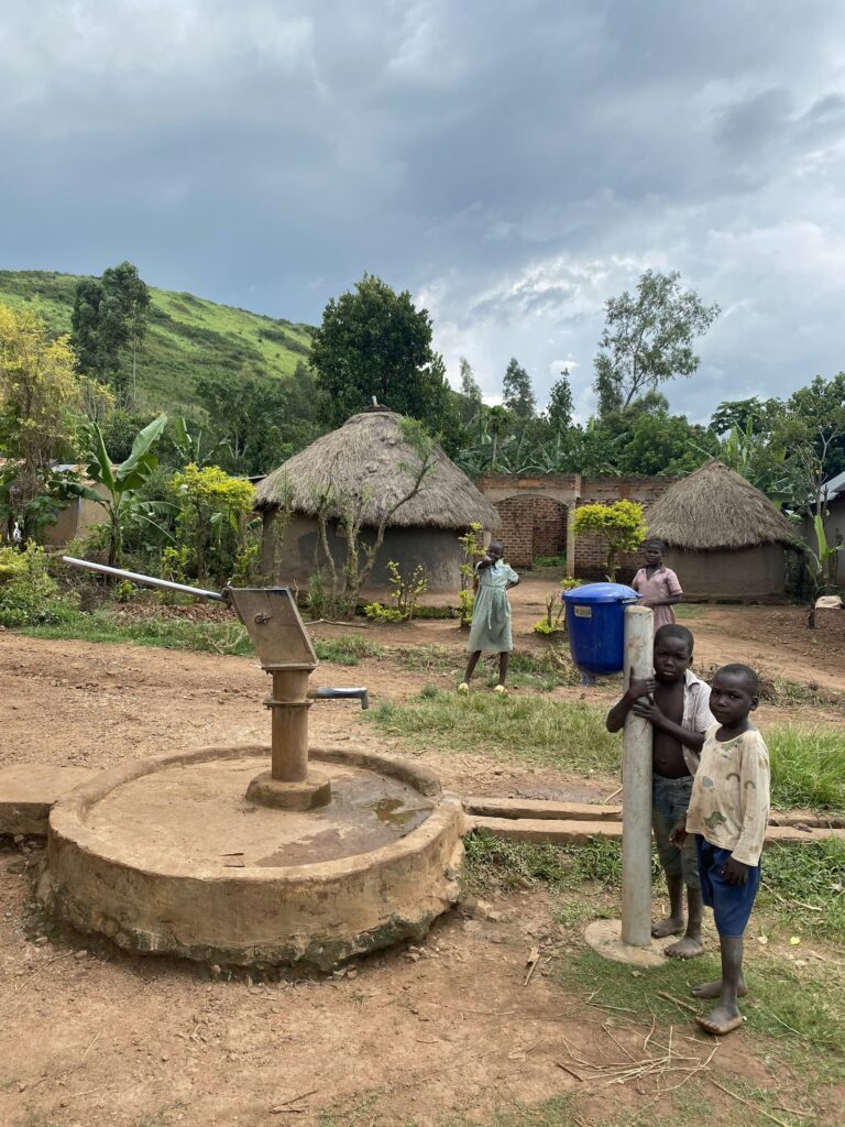 Children drawing clean water from a well